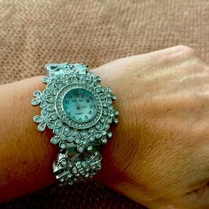 Silver cuffed watch bracelet with lots of bling. Needs battery.